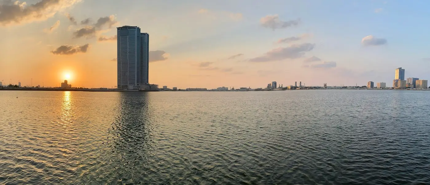 Ras Al Khaimah creek at sunset, with Julphar Towers on the water
